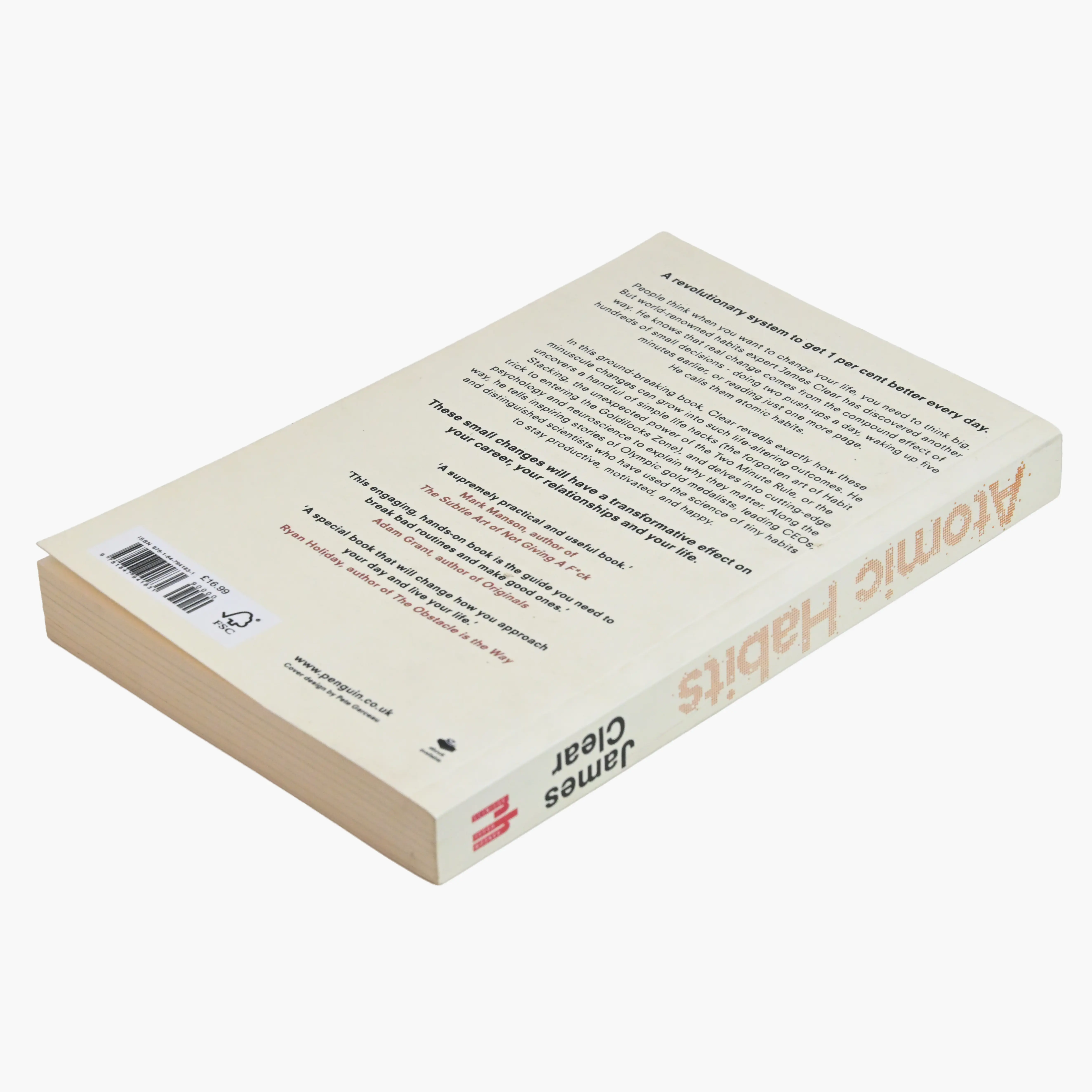 Stack of perfect-bound nonfiction paperbacks with printed spines